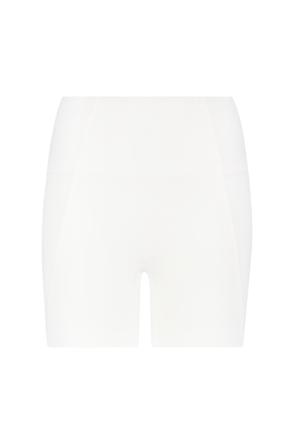 The Mila Short by Gigi C Sport are white seamless compression shorts that provide a smooth, comfortable fit. Featuring a subtle faux snakeskin texture, these shorts offer both support and flexibility, perfect for sports or casual wear. Photographed on a plain white background.