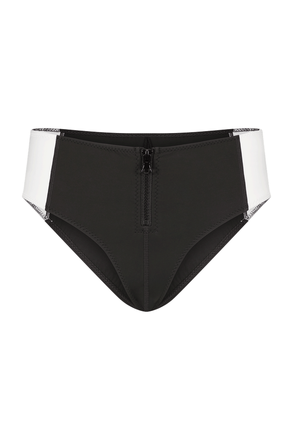 The Bianca Short-inspired bikini bottom from Gigi C Bikinis features a black and white color-block design with a central front zipper, cheeky coverage, contrasting sides in white, and sleek black fabric with visible stitching.