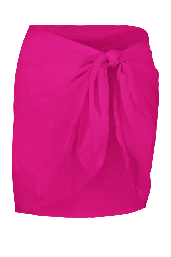 The Willa Sarong by Gigi C Bikinis in bright pink is a silky soft, sheer mesh, tie-front design. Styled as a skirt, this lightweight piece is ideal for beachwear or casual summer attire with its subtle and flowing texture.