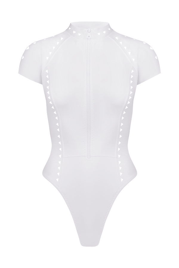 The Lydia Surfsuit by Gigi C Bikinis is a white short-sleeve bodysuit with cutout design, center-front locking zipper, and side triangle detailing.