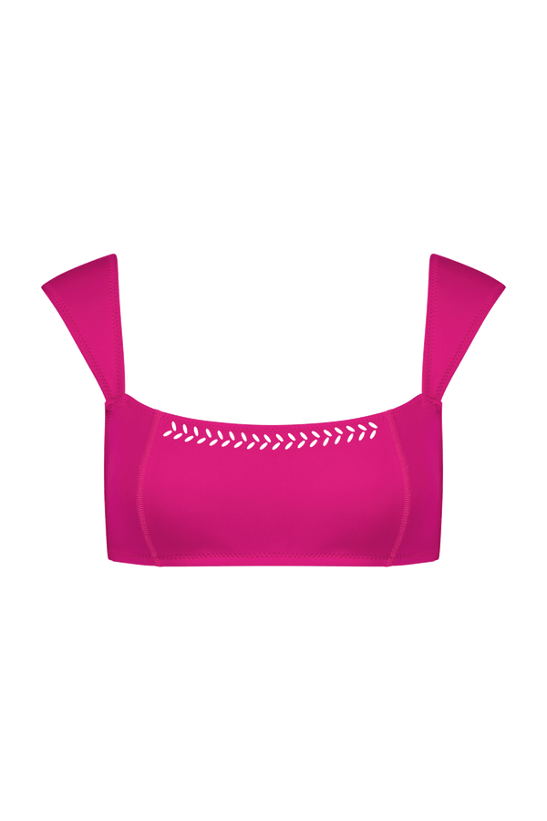 The Tabitha Top by Gigi C Bikinis is a vibrant pink bikini top with wide shoulder straps and zigzag laser-cutouts along the neckline, ideal for pairing with high-waist bottoms to create a simple yet bold beach look.