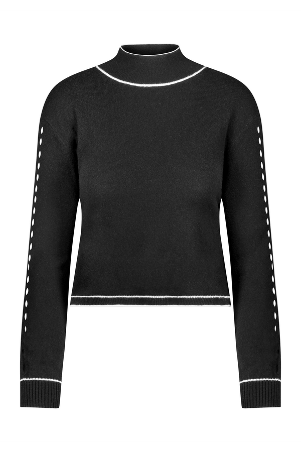The Jacqueline Pullover by Gigi C Lounge is a black long-sleeve sweater featuring white dotted lines on the sleeves and white trim at cuffs, collar, and hem. Made from a luxurious wool blend, it has a high neckline and fitted silhouette for added elegance.
