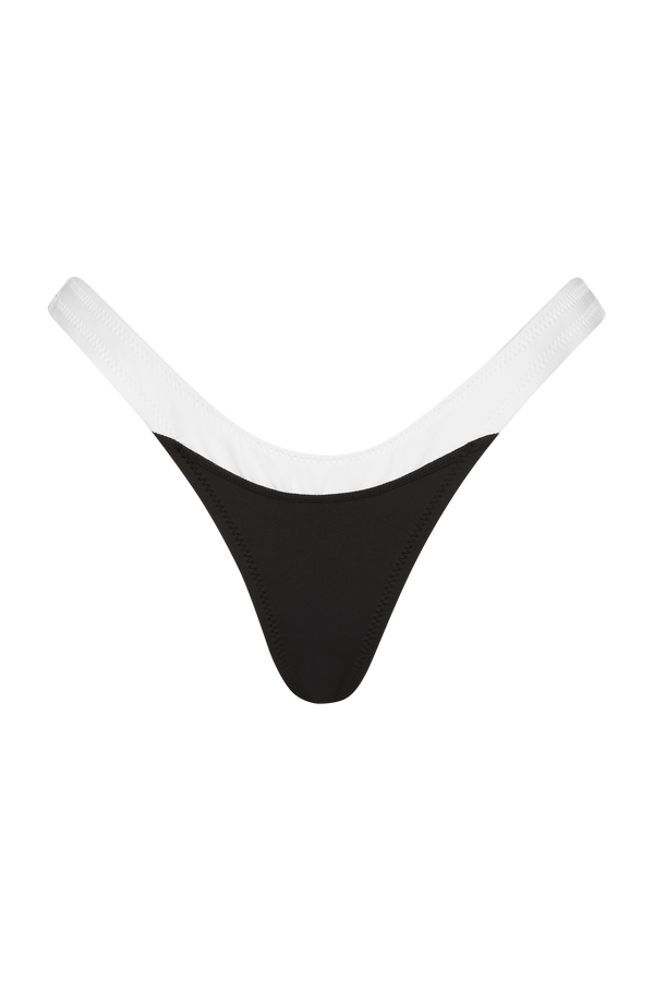 The Brett Bottom by Gigi C Bikinis is a black thong with a white elastic waistband, providing minimal coverage and a sporty, sexy look, showcased on a plain black background.