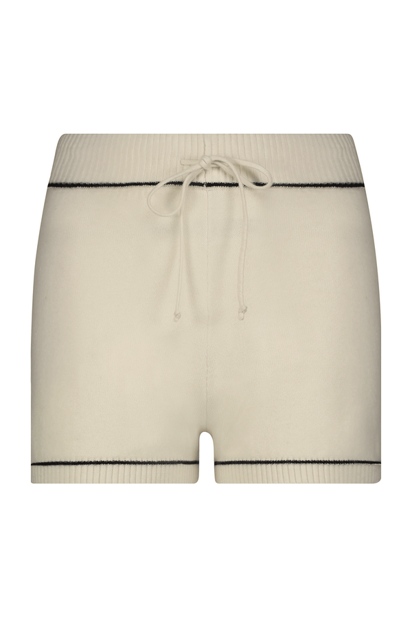 Discover the Danica Short by Gigi C Lounge: a luxurious cream-colored wool/cashmere blend with black trim. Features a ribbed waistband and front drawstring for ultimate comfort and style in your loungewear collection.