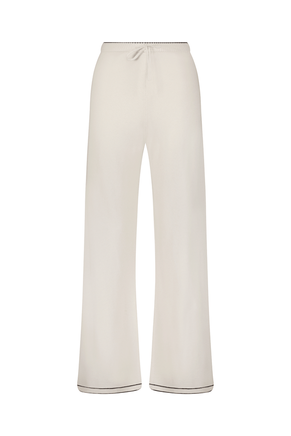 The Aubrie Wide Leg Pant by Gigi C Lounge combines style and comfort with an elastic waistband and subtle stitch details, offering versatility in beige as luxe loungewear on a plain white background.