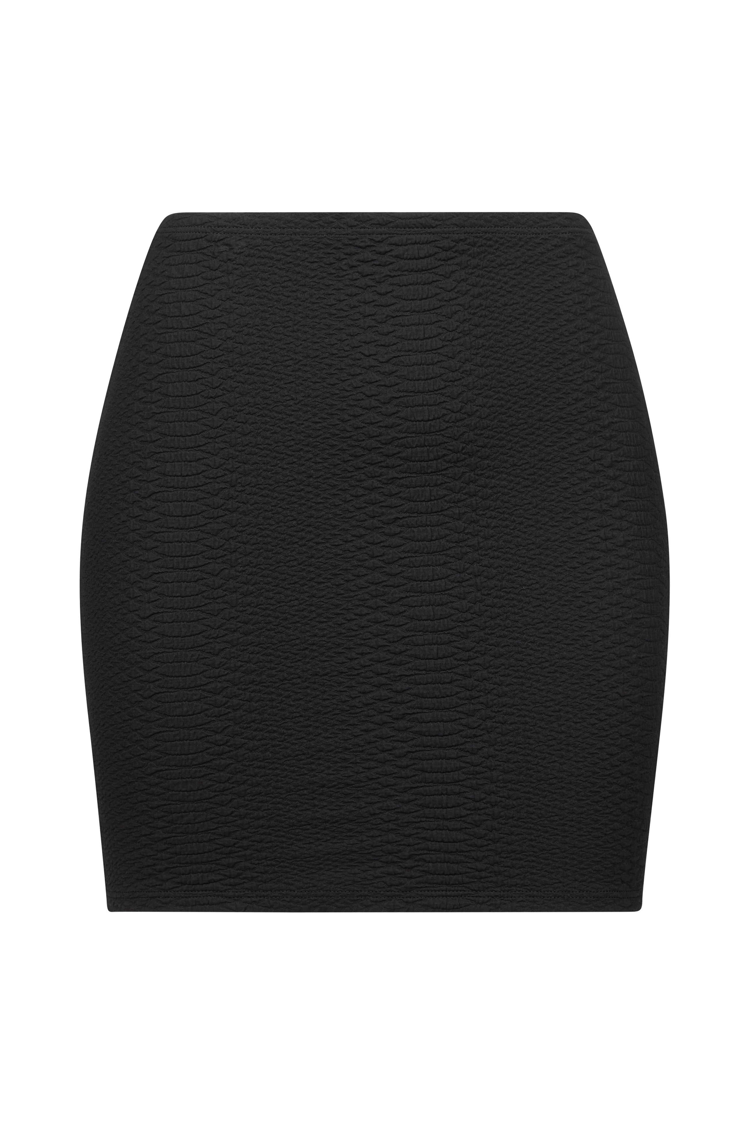The Joelle Skirt by Gigi C Bikinis is a black, form-fitting mini skirt with an embossed snakeskin-like sheen. It offers a smooth, streamlined silhouette without visible zippers or pockets.