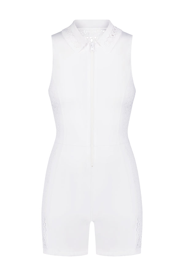 Discover the Gigi C Sport Mina Romper: a sleeveless, white piece with a chic collar and front zipper. Ideal for activewear, it includes subtle lace-like side detailing and provides UV protection for sunny days.