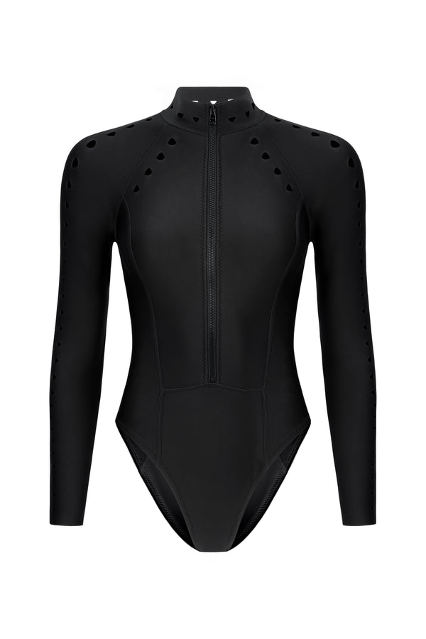 The Riley Surfsuit Full Coverage by Gigi C Bikinis is a black long-sleeve bodysuit made from scuba fabric. It boasts triangle laser cutouts on the sleeves and shoulders, a high neckline, front zip closure, and a fitted design.