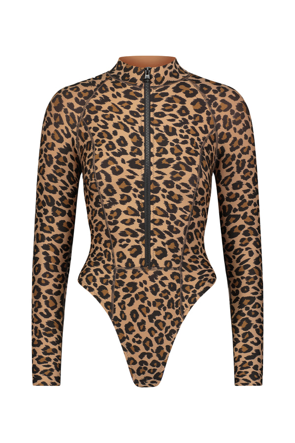 Discover the chic allure of Gigi C Bikinis Kendall Surfsuit, crafted from signature scuba fabric with a bold leopard print and convenient front zipper, perfectly blending style and functionality for the modern fashionista.