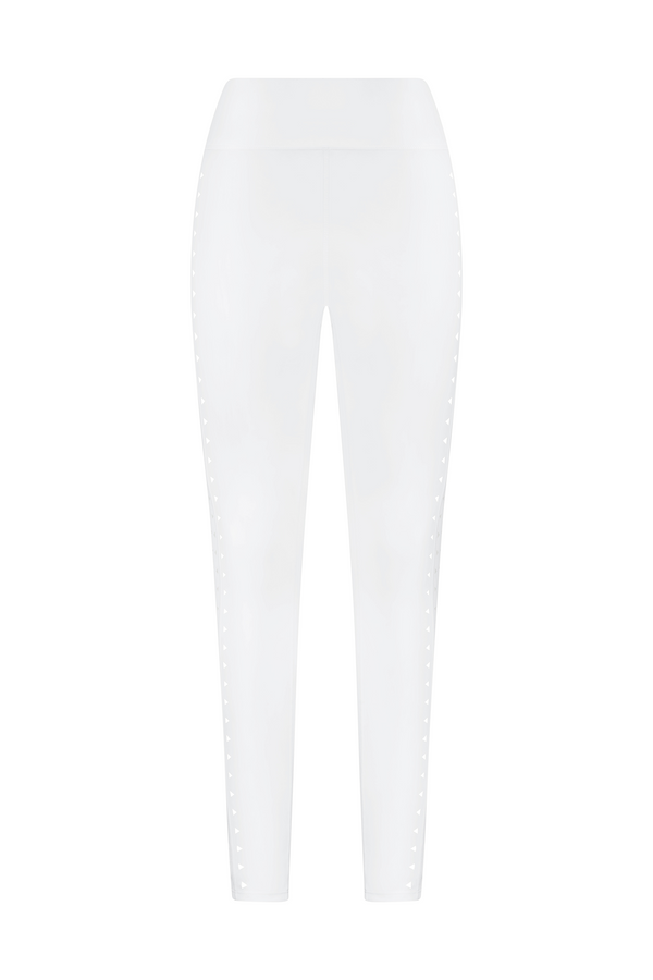 The Gigi C Sport Katrina Legging in white features subtle side details and laser cutouts for a sleek, simple look. Made with compression fabric, it’s perfect for casual or athletic wear. Its elegance is highlighted in the front view against a plain backdrop.